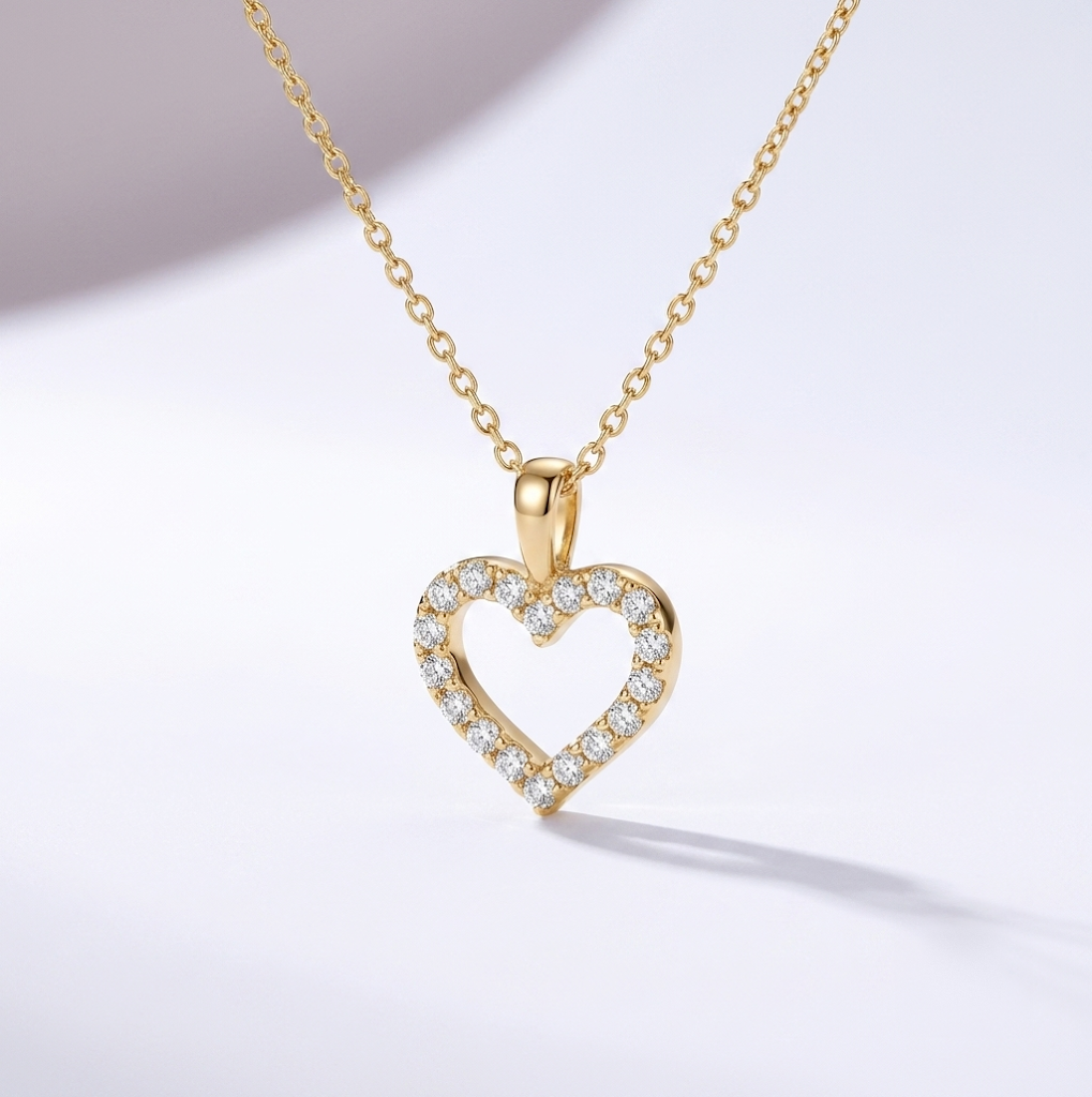 Pavé Heart — halsband med öppet hjärta kantat av gnistrande stenar, guld