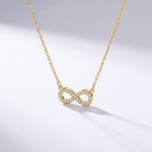 Förevigt Halsband — evighetssymbol kantad av gnistrande stenar, guld